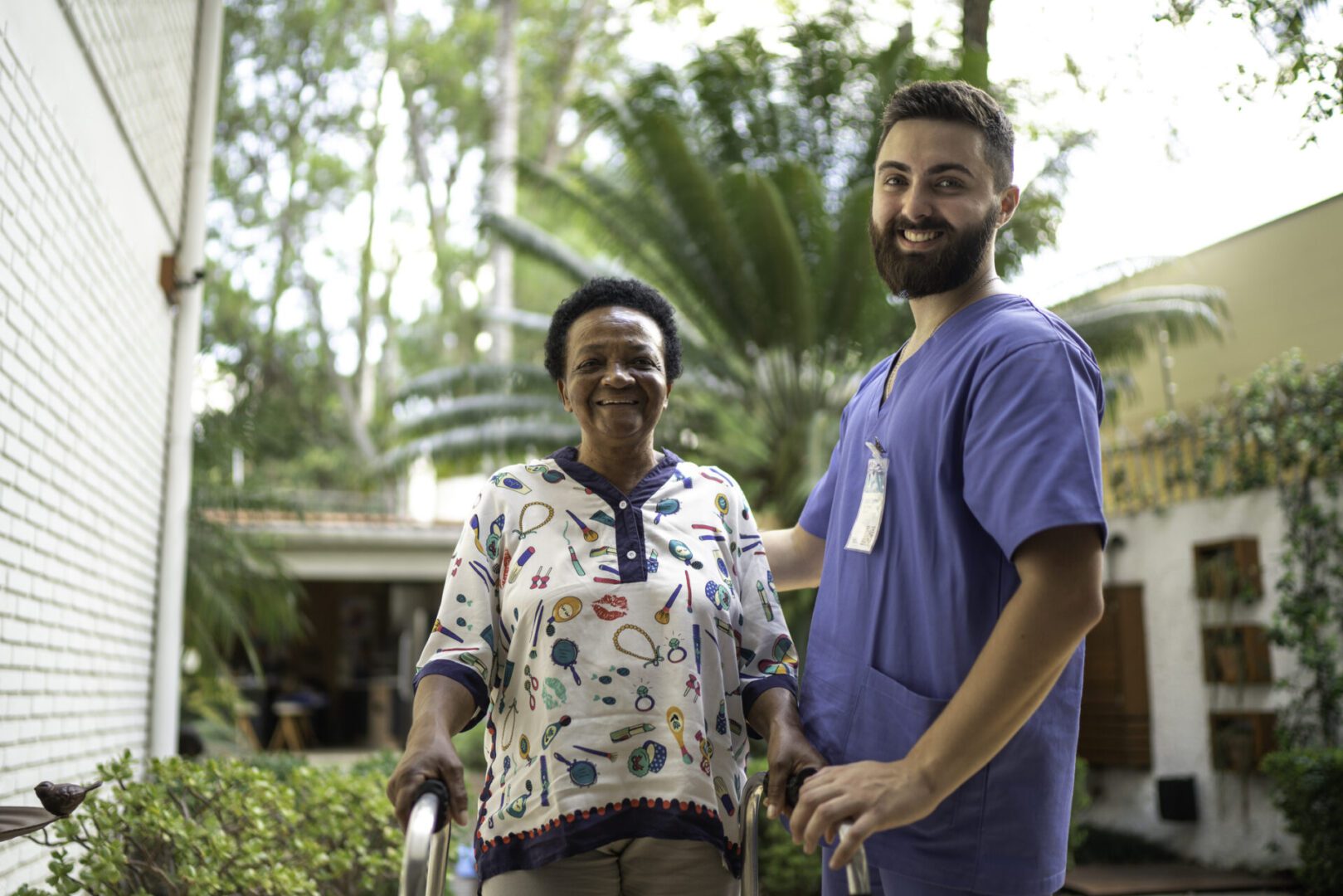 Portrait of smiling home caregiver and senior woman