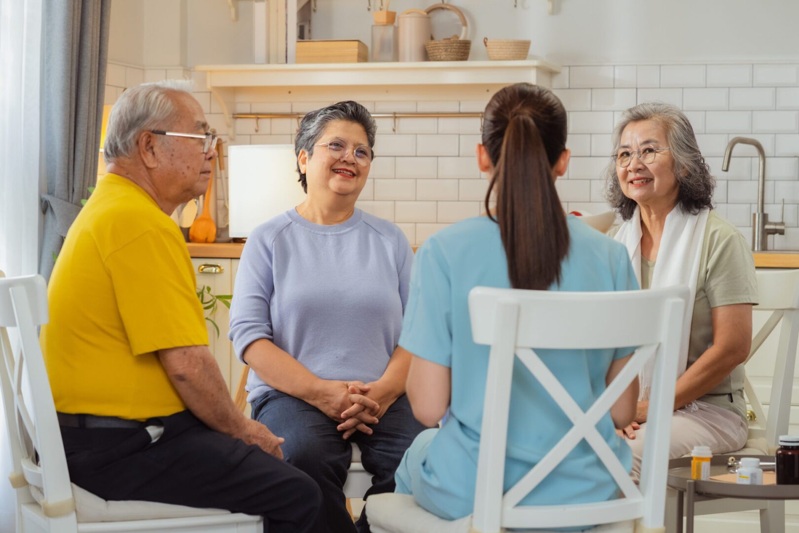 Senior retirees gather for weekend wellness group therapy session with compassionate nurse, sharing life experiences and fostering peaceful connections through supportive homecare in comfortable retirement community